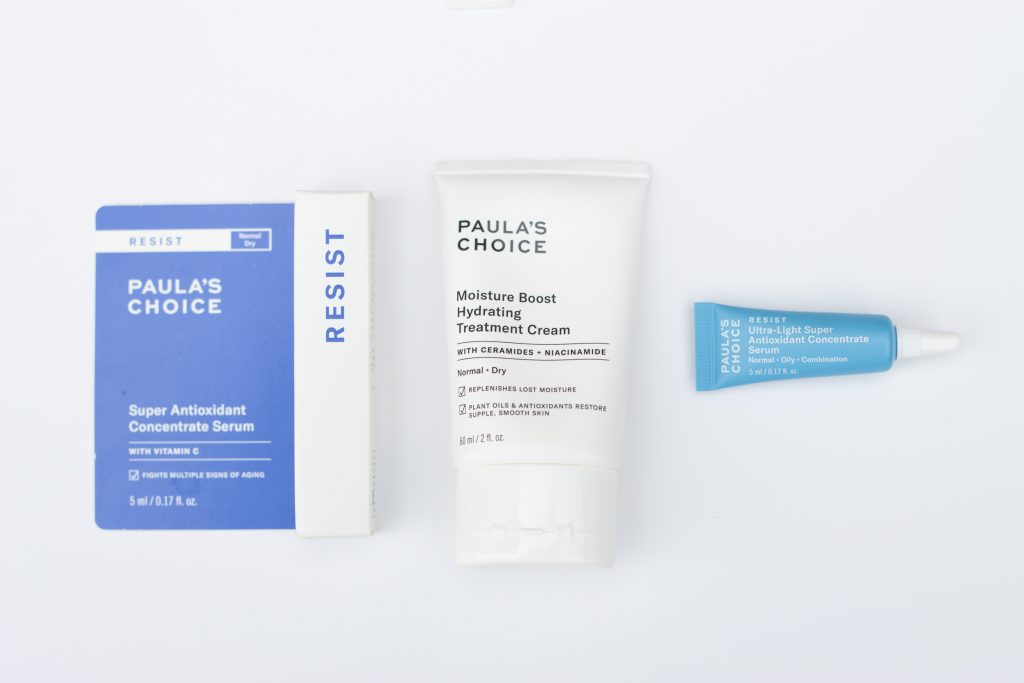 Three skincare items lined up on a white background